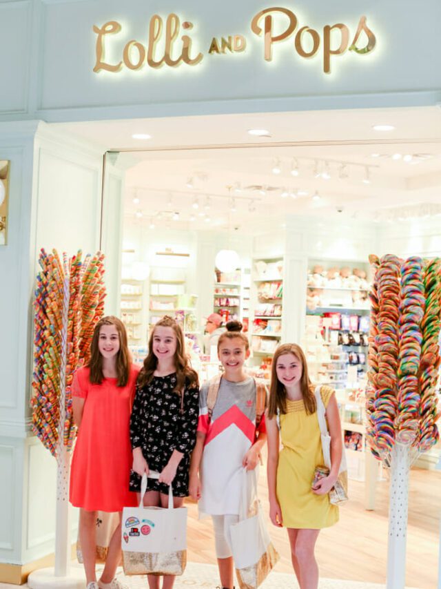 4 girls standing in a mall